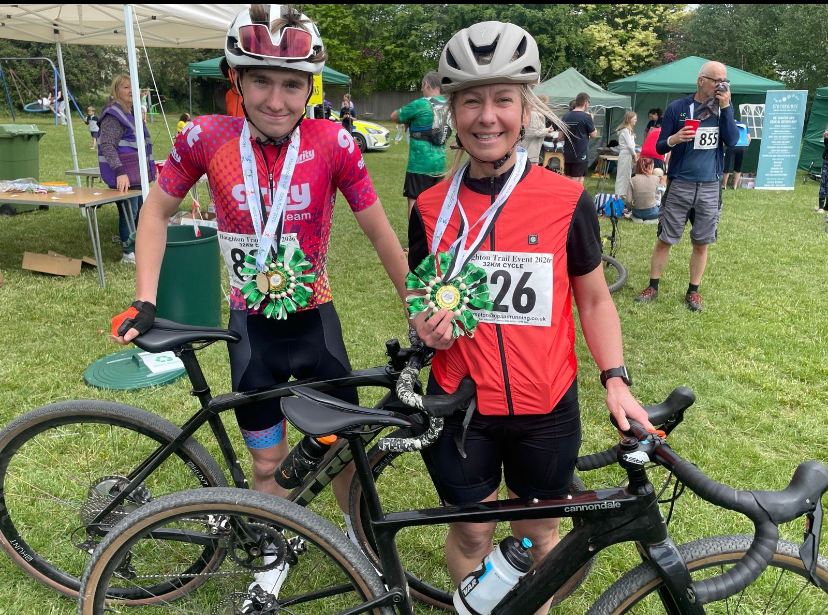 Riders with medals at a community trail cycling event